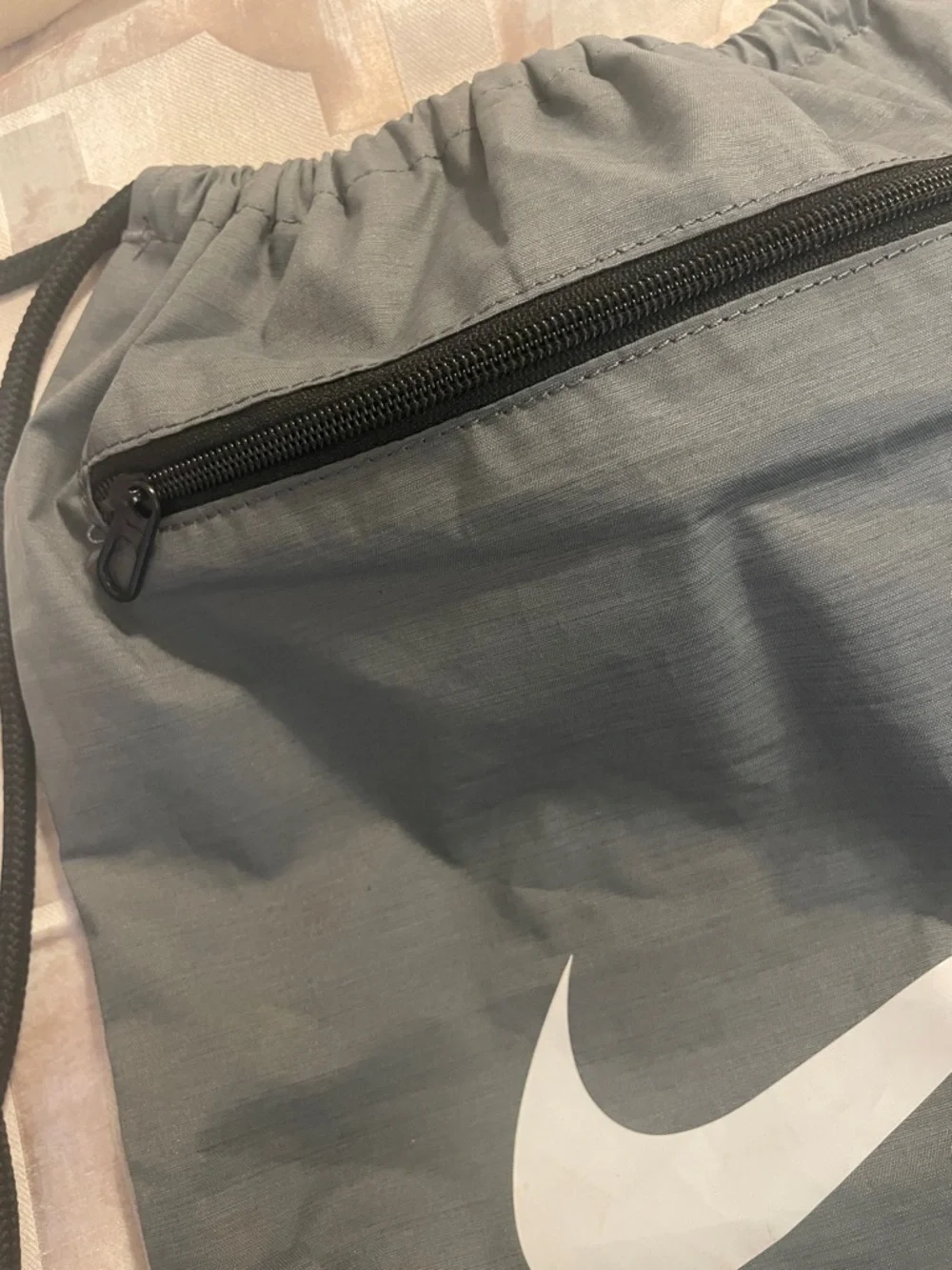 Nike Gray and Black Drawstring Backpack with White Swoosh